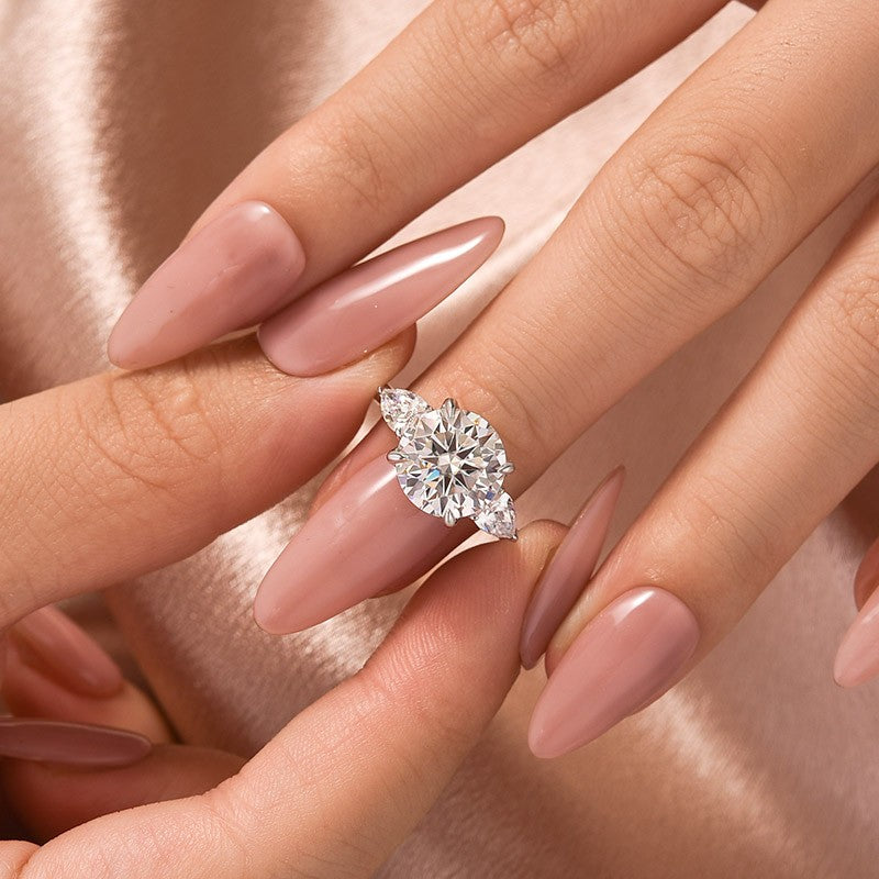 Moissanite 4.0 Ct Round Cut White Gold Engagement Ring with Pear Cut Side Stone