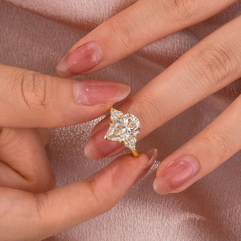 Gelovely Moissanite 3.0 Ct Pear Cut Yellow Gold Engagement Ring with Round Cut Side Stone