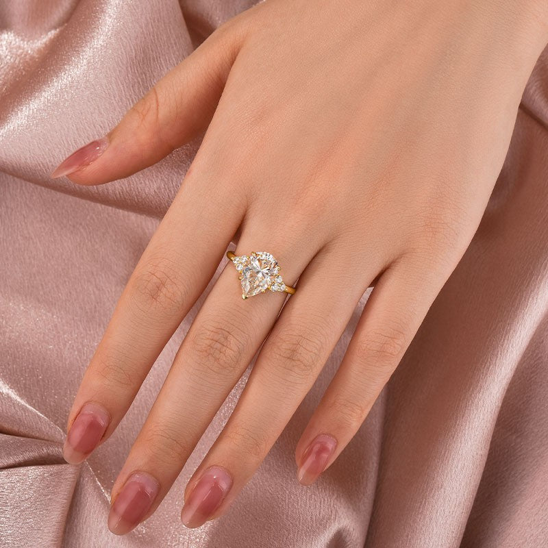 Gelovely Moissanite 3.0 Ct Pear Cut Yellow Gold Engagement Ring with Round Cut Side Stone