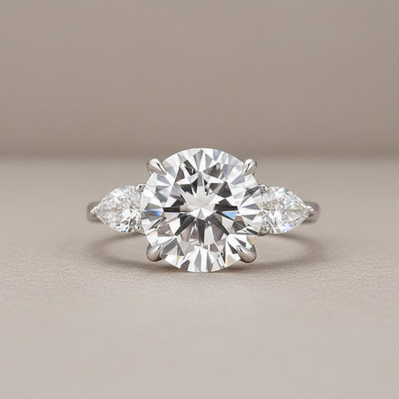 Moissanite 4.0 Ct Round Cut White Gold Engagement Ring with Pear Cut Side Stone